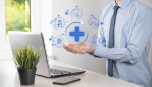 Businessman hold virtual plus medical network connection icons. Covid-19 pandemic develop people awareness and spread attention on their healthcare.Doctor,document,medicine,ambulance,patient icon.