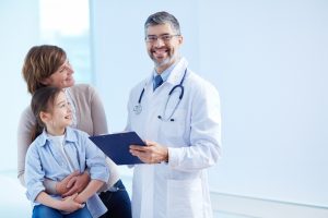 happy-doctor-holding-clipboard-with-patients