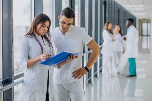 team-young-specialist-doctors-standing-corridor-hospital